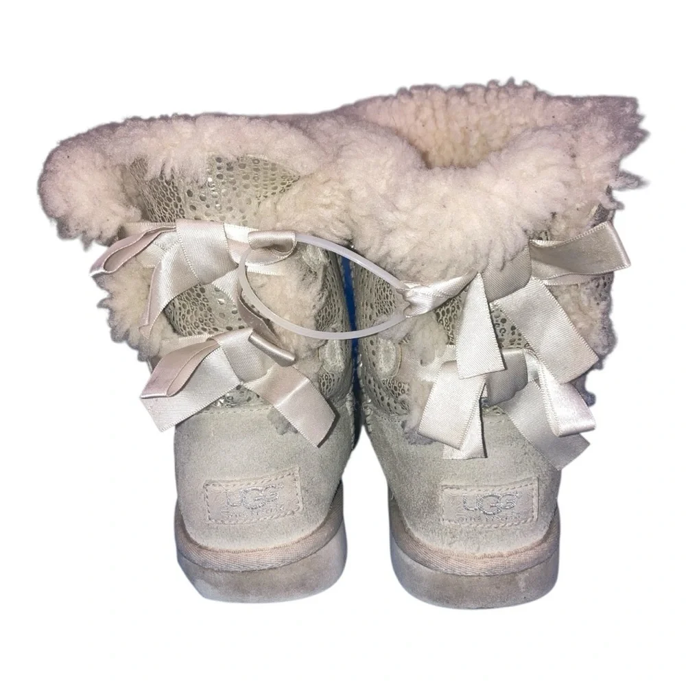 UGG Bailey Bow Bling boots in a light color boots are adorned with silky bows